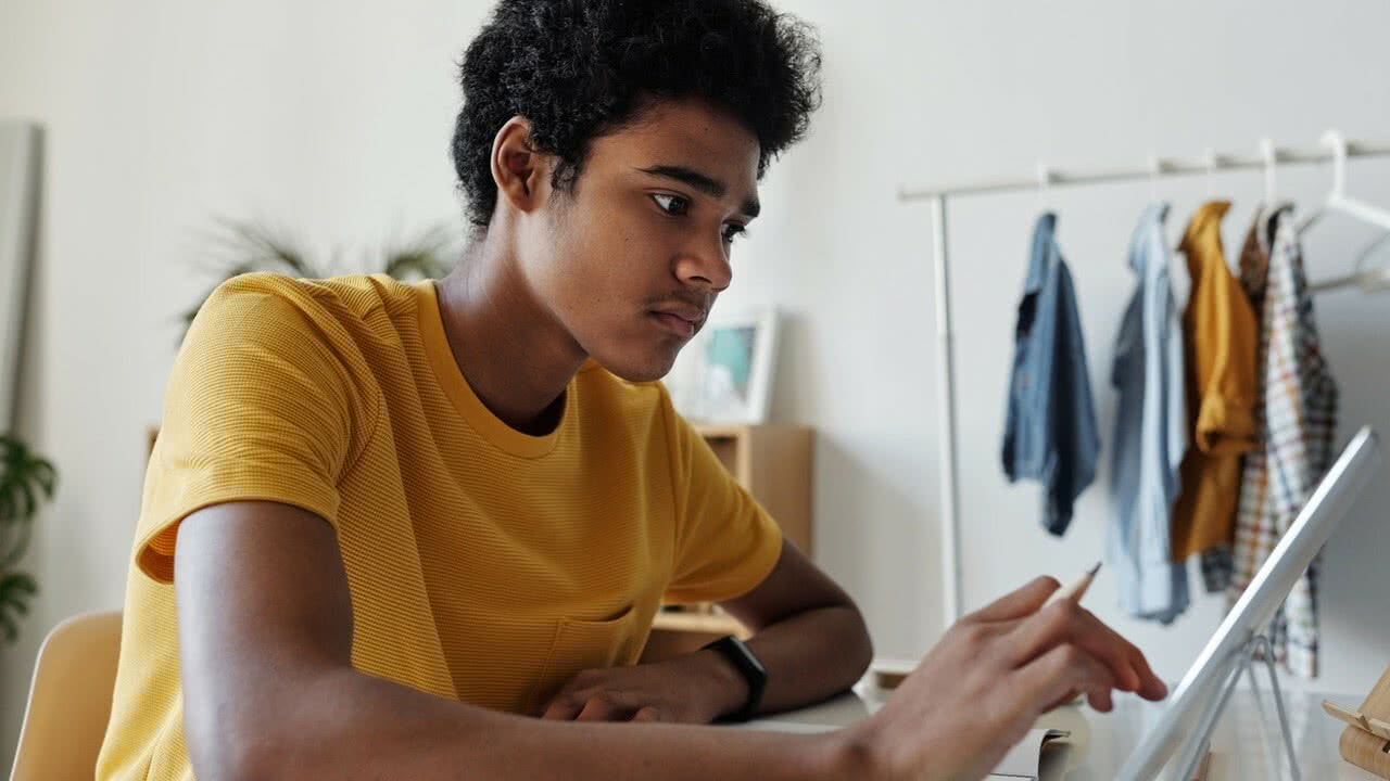 young man working on tablet